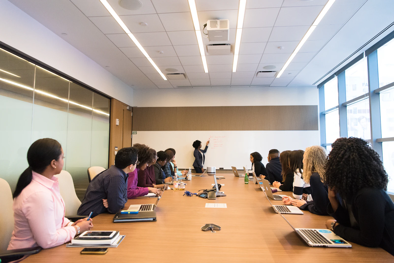 Team leader presenting to colleagues in a meeting